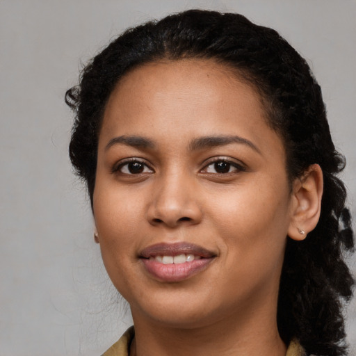Joyful latino young-adult female with medium  black hair and brown eyes