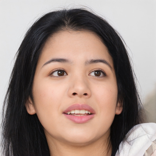 Joyful asian young-adult female with long  brown hair and brown eyes