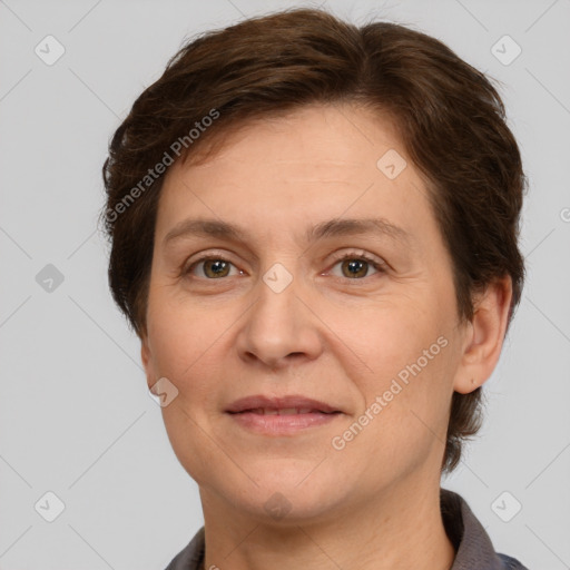 Joyful white adult female with short  brown hair and grey eyes