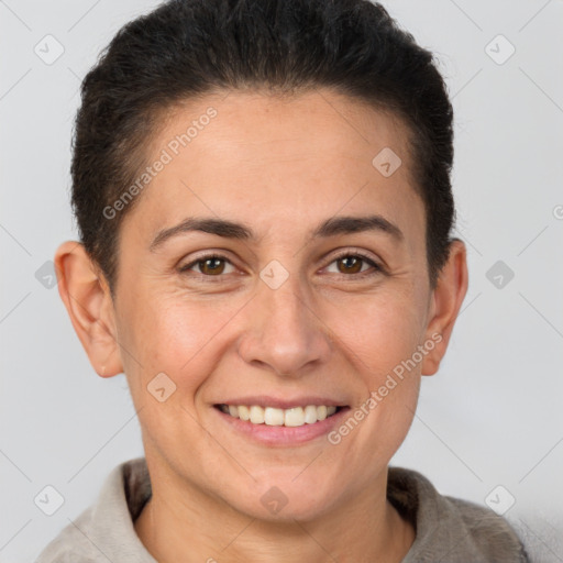 Joyful white adult female with short  brown hair and brown eyes