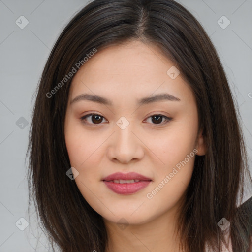 Joyful asian young-adult female with long  brown hair and brown eyes