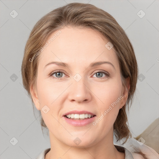 Joyful white young-adult female with medium  brown hair and grey eyes