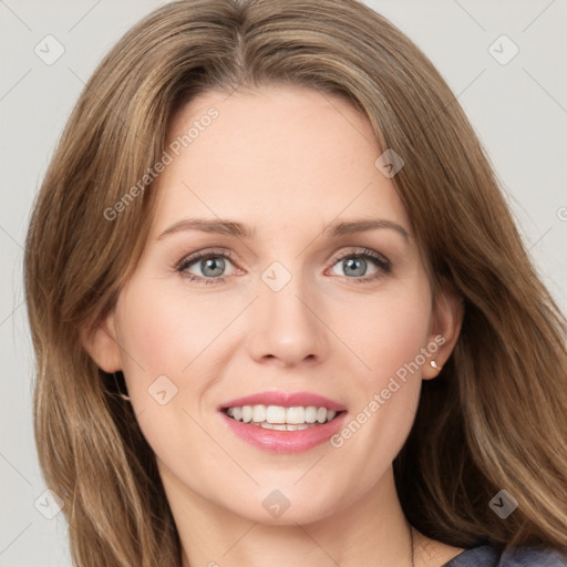 Joyful white young-adult female with medium  brown hair and green eyes