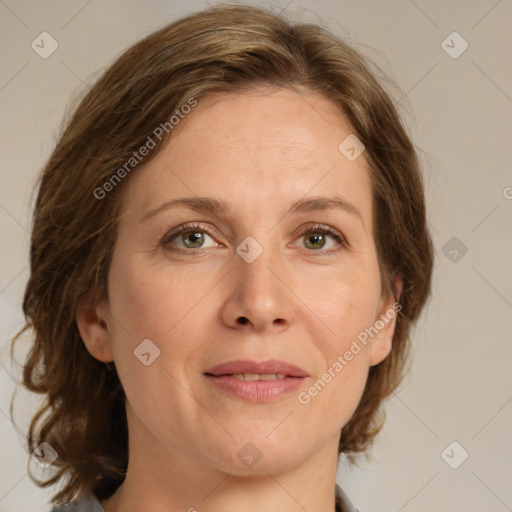 Joyful white adult female with medium  brown hair and grey eyes