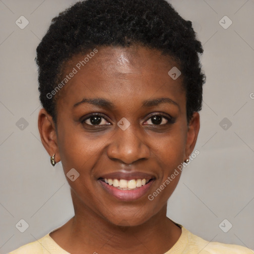 Joyful black young-adult female with short  black hair and brown eyes