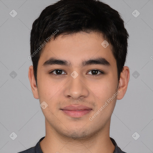 Joyful asian young-adult male with short  black hair and brown eyes