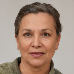 Joyful white adult female with short  brown hair and brown eyes