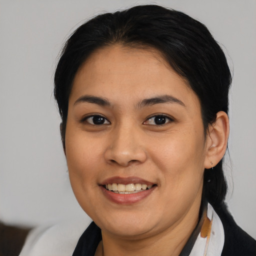 Joyful asian young-adult female with medium  brown hair and brown eyes