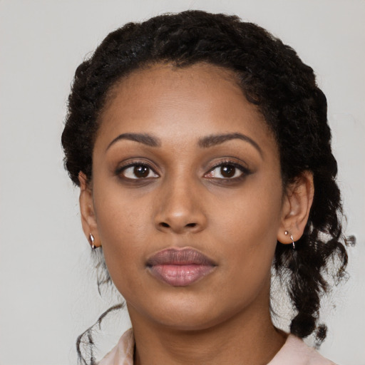 Neutral black young-adult female with medium  black hair and brown eyes