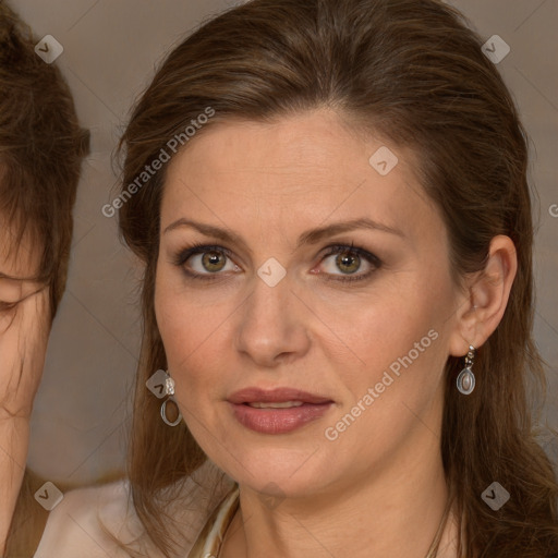 Joyful white adult female with long  brown hair and brown eyes