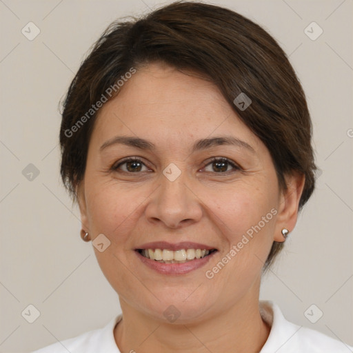 Joyful white adult female with medium  brown hair and brown eyes