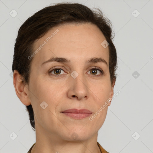 Joyful white adult female with short  brown hair and grey eyes