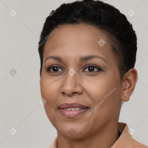 Joyful black adult female with short  brown hair and brown eyes