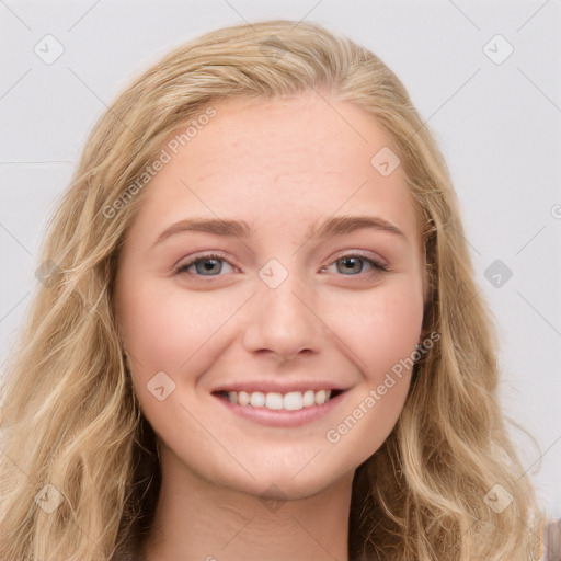 Joyful white young-adult female with long  brown hair and blue eyes