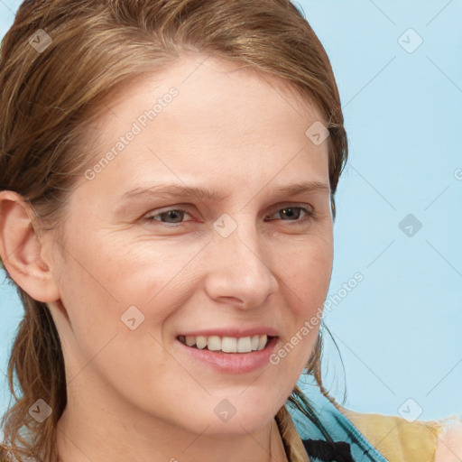 Joyful white young-adult female with medium  brown hair and blue eyes