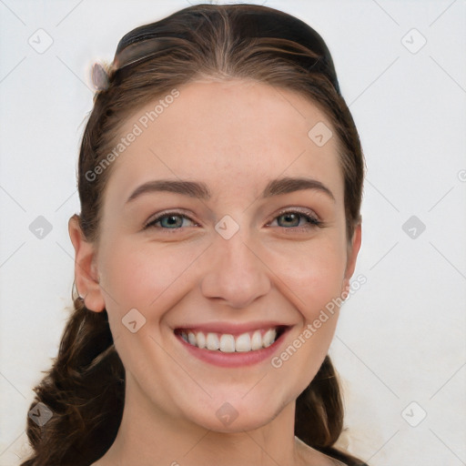 Joyful white young-adult female with long  brown hair and blue eyes