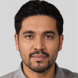 Neutral latino young-adult male with short  black hair and brown eyes