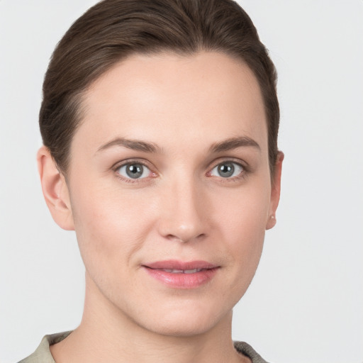 Joyful white young-adult female with short  brown hair and grey eyes