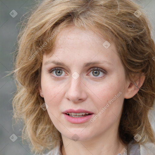 Joyful white young-adult female with medium  brown hair and blue eyes