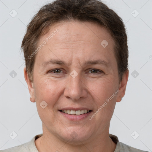 Joyful white adult female with short  brown hair and grey eyes