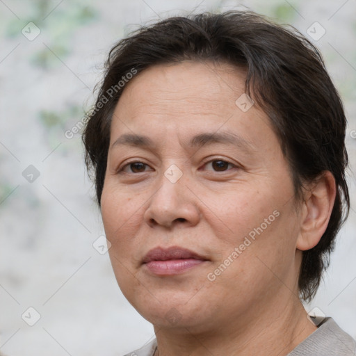 Joyful white adult female with short  brown hair and brown eyes