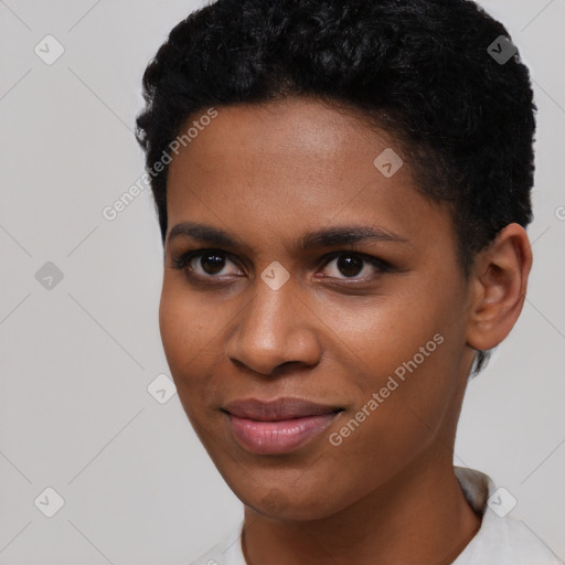 Joyful black young-adult female with short  black hair and brown eyes