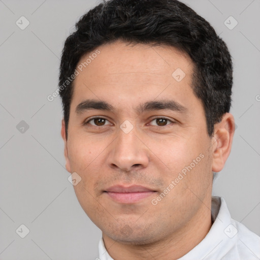 Joyful white young-adult male with short  black hair and brown eyes