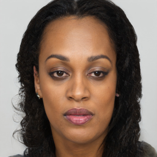 Neutral black young-adult female with long  brown hair and brown eyes
