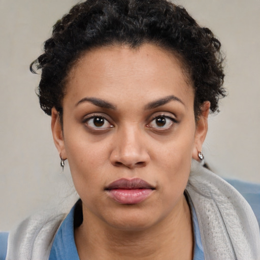 Neutral latino young-adult female with short  brown hair and brown eyes