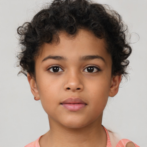 Neutral latino child male with short  brown hair and brown eyes