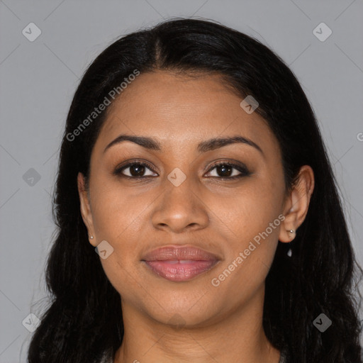 Joyful black young-adult female with long  black hair and brown eyes