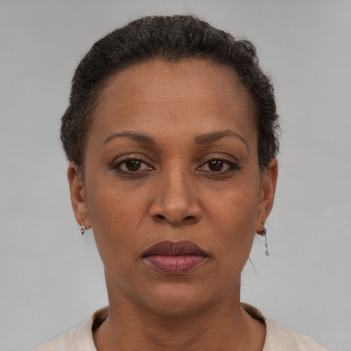 Neutral black adult female with short  brown hair and brown eyes
