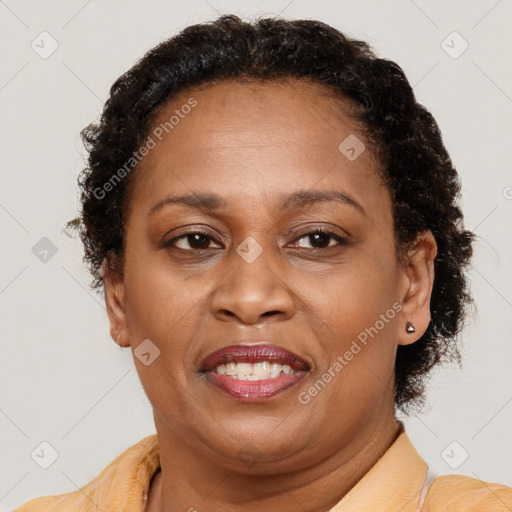 Joyful latino adult female with short  brown hair and brown eyes