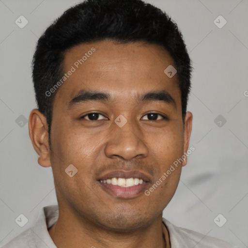 Joyful latino young-adult male with short  black hair and brown eyes