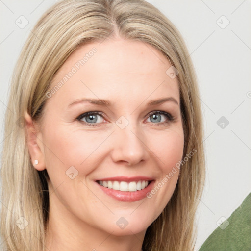 Joyful white young-adult female with long  brown hair and blue eyes