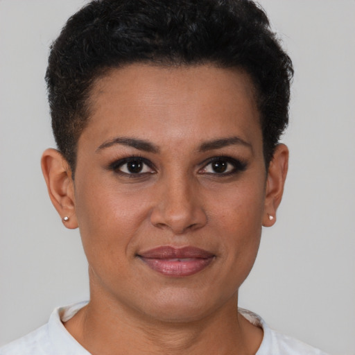 Joyful latino young-adult female with short  brown hair and brown eyes