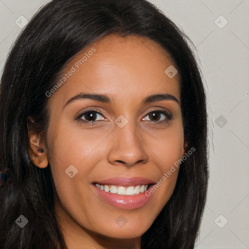 Joyful latino young-adult female with long  brown hair and brown eyes