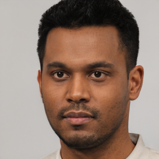 Neutral latino young-adult male with short  black hair and brown eyes