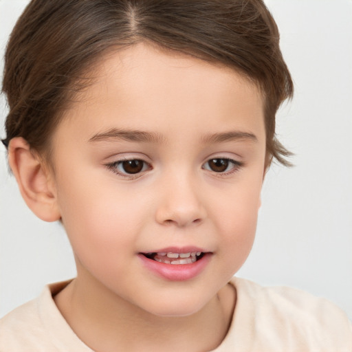 Joyful white child female with short  brown hair and brown eyes