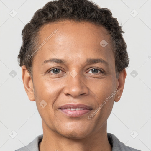 Joyful white adult female with short  brown hair and brown eyes