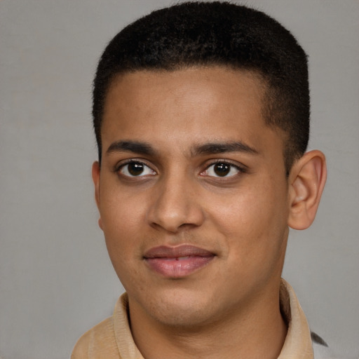 Joyful black young-adult male with short  brown hair and brown eyes