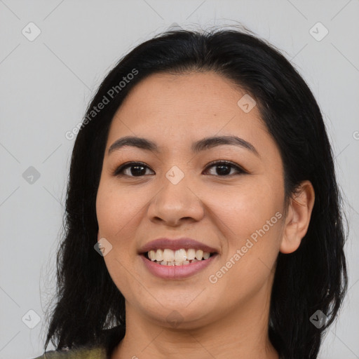 Joyful latino young-adult female with medium  brown hair and brown eyes