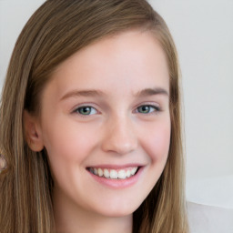 Joyful white young-adult female with long  brown hair and blue eyes