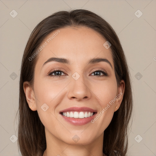 Joyful white young-adult female with long  brown hair and brown eyes