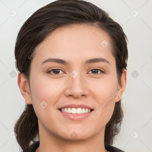 Joyful white young-adult female with long  brown hair and brown eyes