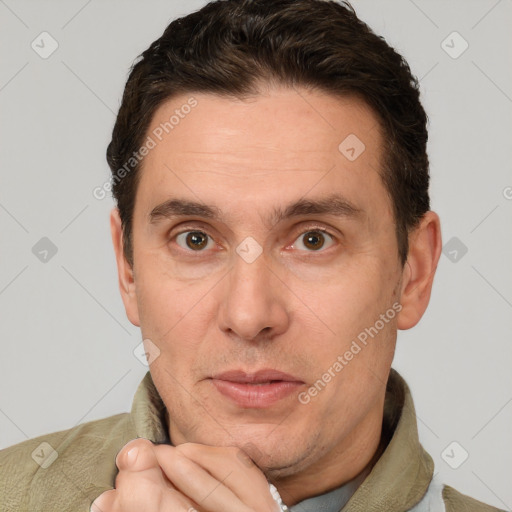 Joyful white adult male with short  brown hair and brown eyes