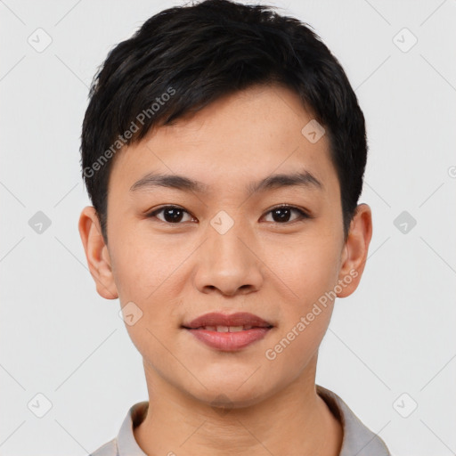 Joyful asian young-adult male with short  black hair and brown eyes