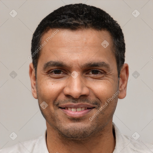 Joyful latino adult male with short  black hair and brown eyes