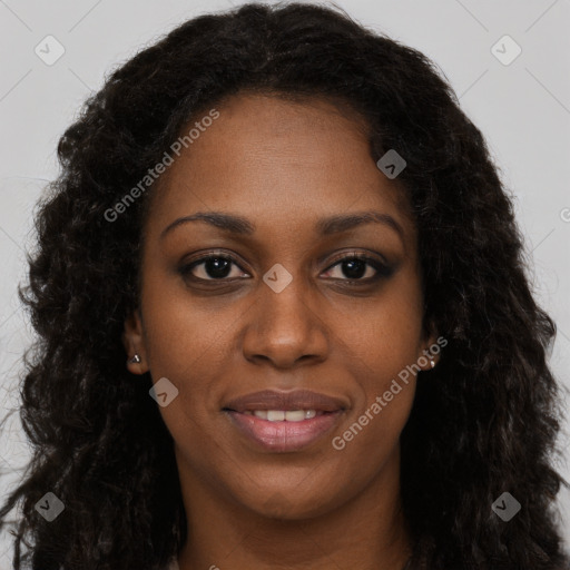 Joyful black young-adult female with long  brown hair and brown eyes