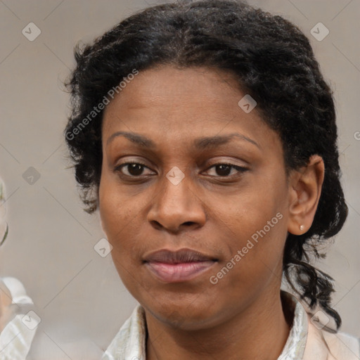 Joyful black adult female with short  brown hair and brown eyes